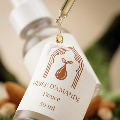 Flacon d’huile d’amande douce 50 ml, avec compte-gouttes, étiquette brune.