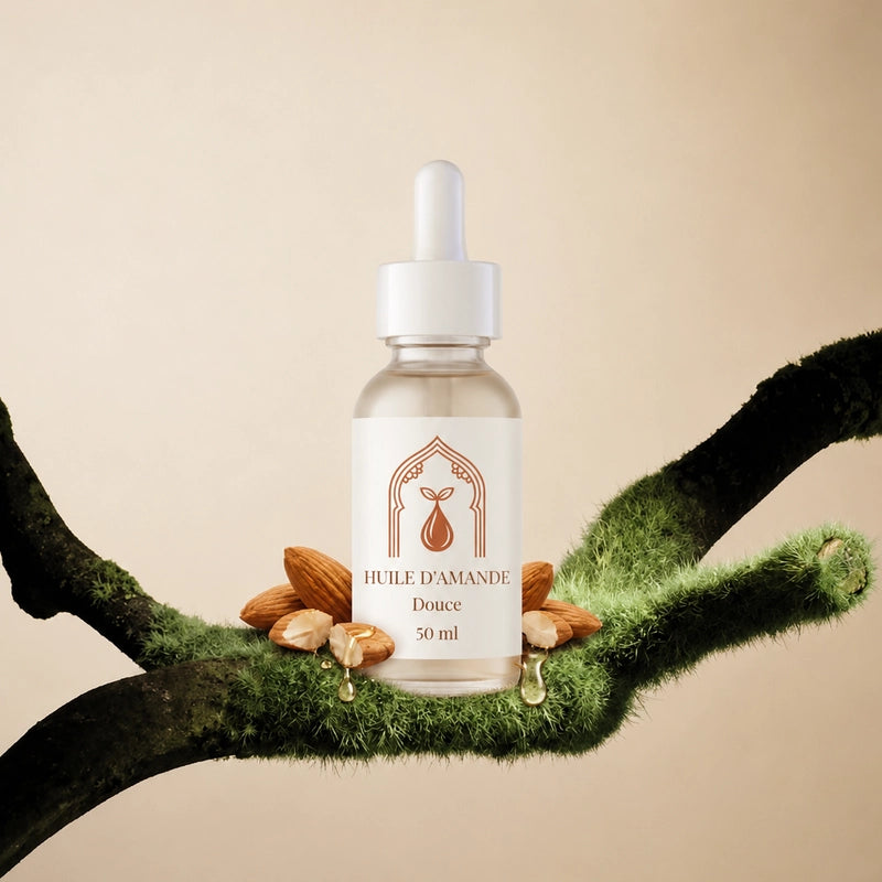 Flacon d’huile d’amande douce 50 ml entre deux branches en peluche, compte-gouttes.