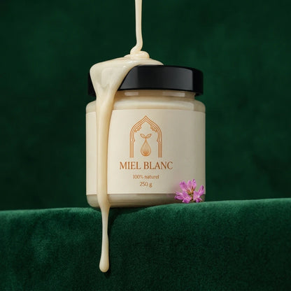 Pot de miel blanc 250 g, couvercle noir, filet de miel qui s’écoule vers le bas