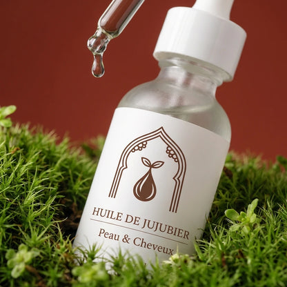 Flacon d’huile de jujubier blanche avec pipette, étiquette « Peau & Cheveux ».